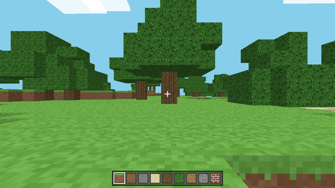 VoxelCraft by Ox Alpha showing a grassy first-person voxel forest and block hotbar